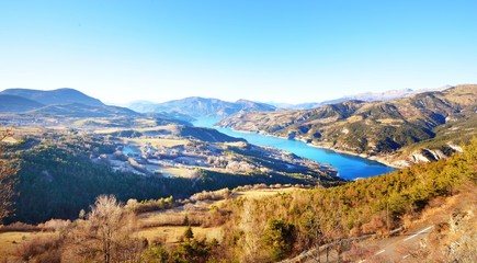 Panoramic view of lake Lac de serre-poncon in French Alps on a clear day