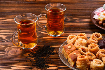Turkish sweet baklava on plate with Turkish tea.
