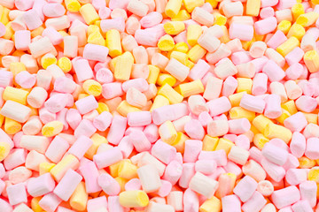 Marshmallow. Background of pink and yellow colorful mini marshmallows.