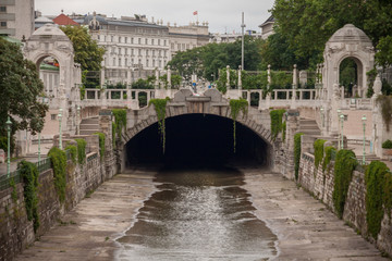 Wienfluss Vienna River flowing under the bridge at Stadtpark, City Park in Vienna, Austria  © Bryukhanova