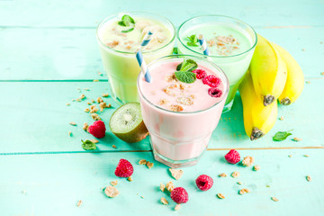 Summer refreshing drinks - protein shakes, milkshakes or smoothies, with fresh berry and fruits,...