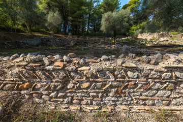 Unusual ancient greek rock wall design and pattern near the Leonidaion in Olympia Greece where the first Olympics were held