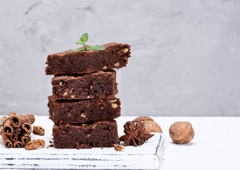 baked square pieces of chocolate brownies with walnuts