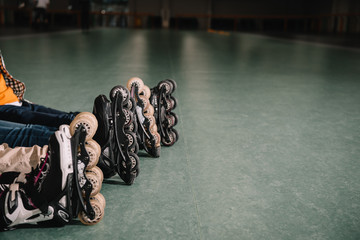 Cropped view of kids wears roller skates