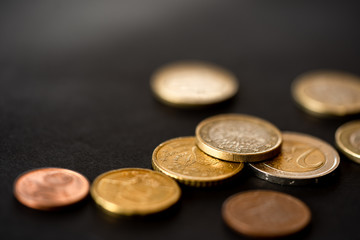group of euro coins on black background
