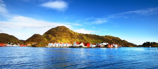 Traditional Norway village in the fjords on a bright day