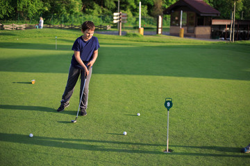 child playing golf