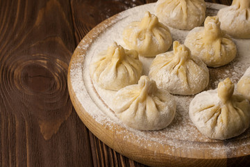 Georgian khinkali on wooden background