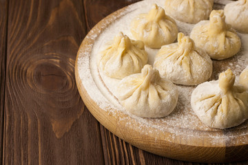 Georgian khinkali on wooden background