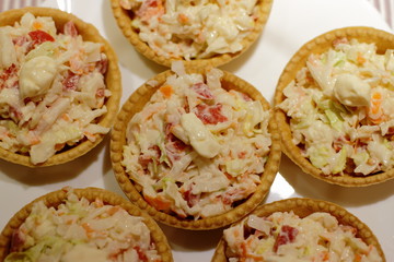 home made pintxos with crab meat and eggs and mayones sause in tartlet, traditional spanish snack 