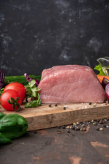 Ingredients for stew cooking: raw meat, herbs,spices,vegetables and  salt on rustic cutting board, copy space