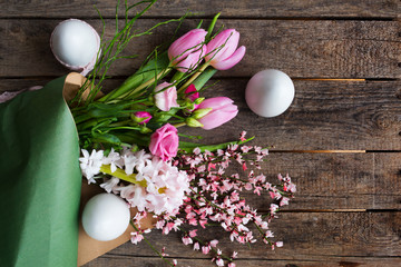 Easter eggs and colorful spring bouquet