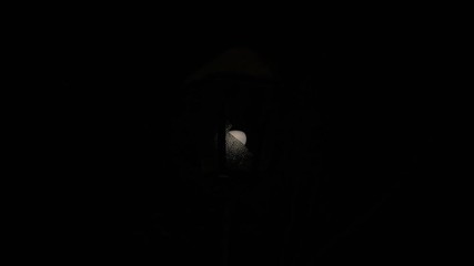 Broken street lamp shining blinking