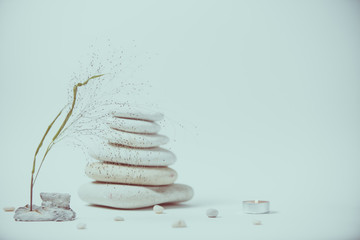 Spa still life with stacked of stone with a beautiful branch