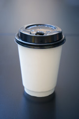 Creative design concept with coffee paper cap with copy space in minimalism style