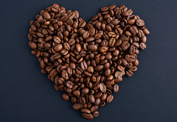 Coffee beans in heart shape white background isolated