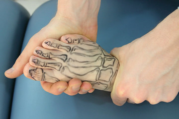 presentation of human foot with drawing of bones on the skin