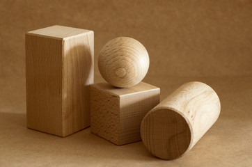 Geometric wooden figures on a beige background