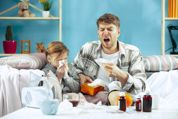 Sick man with daughter at home. Home Treatment. Fighting with a desease. Medical healthcare. Family...