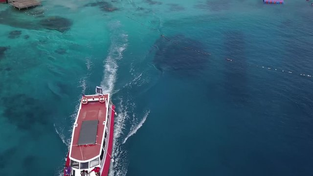 Drone footage from Malaysia island. Beach side tropical season feel.