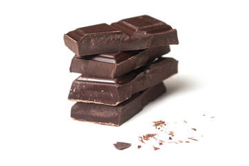 closeup of chocolate blocks pile on white background