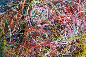 Multi-colored tangled threads abstract texture pattern background. Macro shot of colorful...