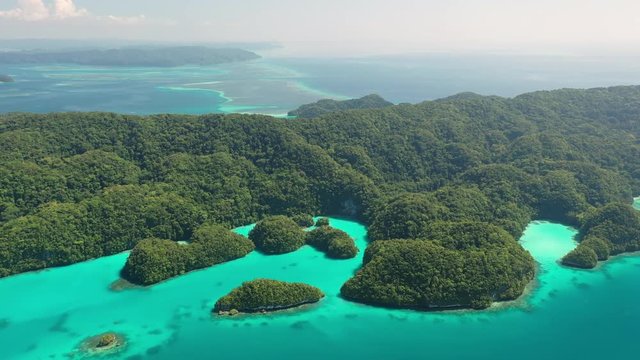 Aerial view of Rock Islands (Chelbacheb), Ngeruktabel island, seascape with colorful coral reefs and lagoons - landscape panorama of Micronesia from above, Palau