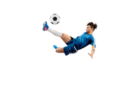 Young boy with soccer ball doing flying kick, isolated on white. football soccer players in motion on studio background. Fit jumping boy in action, jump, movement at game.