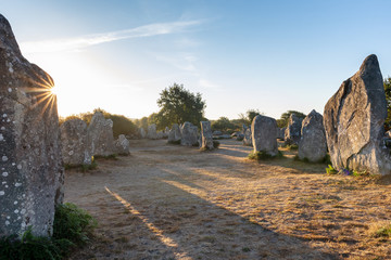 French landscape - Bretagne. A field with several menhirs at sunrise.