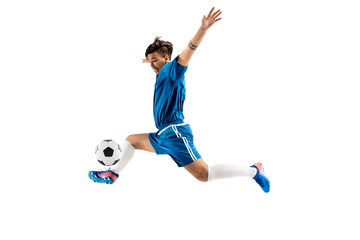 Young boy with soccer ball doing flying kick, isolated on white. football soccer players in motion on studio background. Fit jumping boy in action, jump, movement at game.