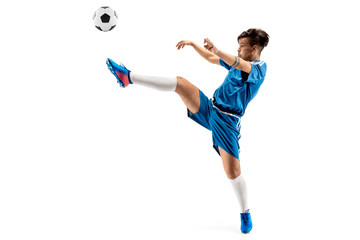 Young boy with soccer ball doing flying kick, isolated on white. football soccer players in motion on studio background. Fit jumping boy in action, jump, movement at game.
