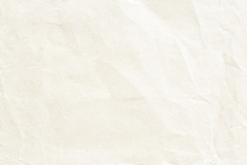 Old crumpled pale yellow paper texture