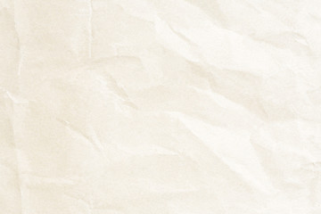 Old crumpled pale yellow paper texture