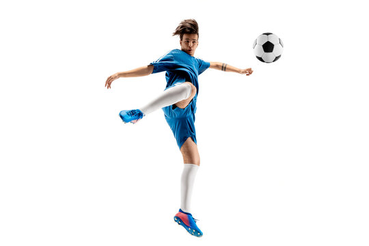 Young boy with soccer ball doing flying kick, isolated on white. football soccer players in motion on studio background. Fit jumping boy in action, jump, movement at game.