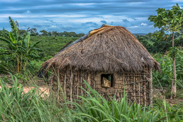 Fototapeta na wymiar View of traditional village, house thatched with roof and terracotta and straw walls