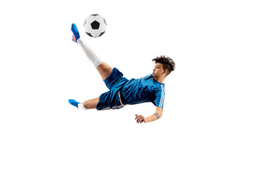 Young boy with soccer ball doing flying kick, isolated on white. football soccer players in motion on studio background. Fit jumping boy in action, jump, movement at game. © master1305