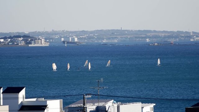 Far view of windsurfing - Powered by Adobe