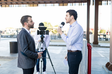 Media Reporters Covering Handsome CEO