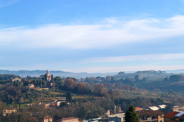 Classic tuscany landscape with mountains in fog and cypress, Siena, Italy