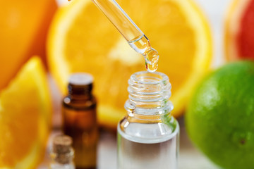 citrus essential oil dripping from dropper
