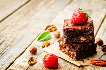 chocolate nut brownie cake decorated with strawberries