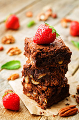 chocolate nut brownie cake decorated with strawberries