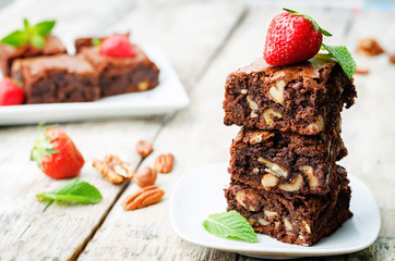 chocolate nut brownie cake decorated with strawberries