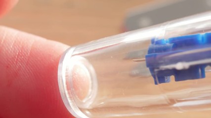 finger pricking to measure blood glucose, extreme macro, blood, strip