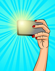 Color vector illustration of a female hand with a phone on a background of halftone. A girl makes a selfie. Design a poster about social networks and communicating with the phone.