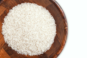 Wooden isolated bowl filled with white rice.