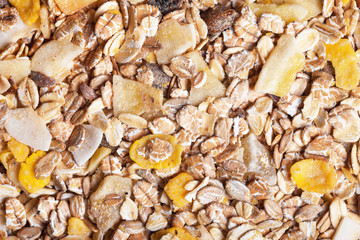 Healthy fat reduction diet studio background. Breakfast oat flakes with mix of dry fruits closeup pattern. 