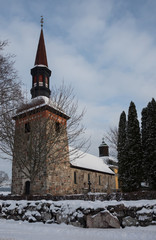 Fototapeta na wymiar Winter view over Lovo church on the Drottningholm island in Stockholm