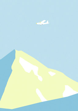 Airplane flying over mountain