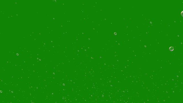 A lot of colorful soap bubbles fly across green screen. Can be added to any footage. 4K